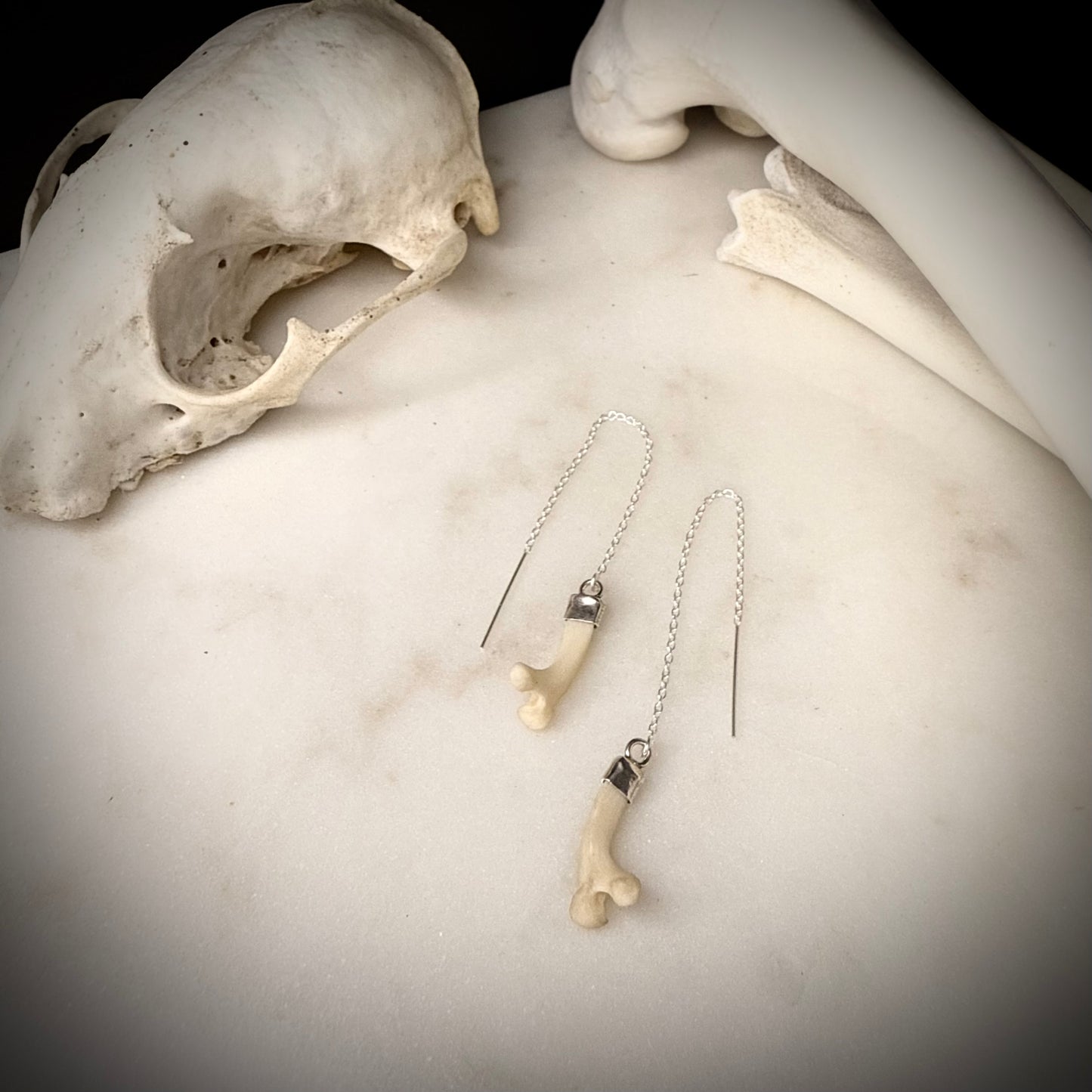 threader earrings with fox ribs