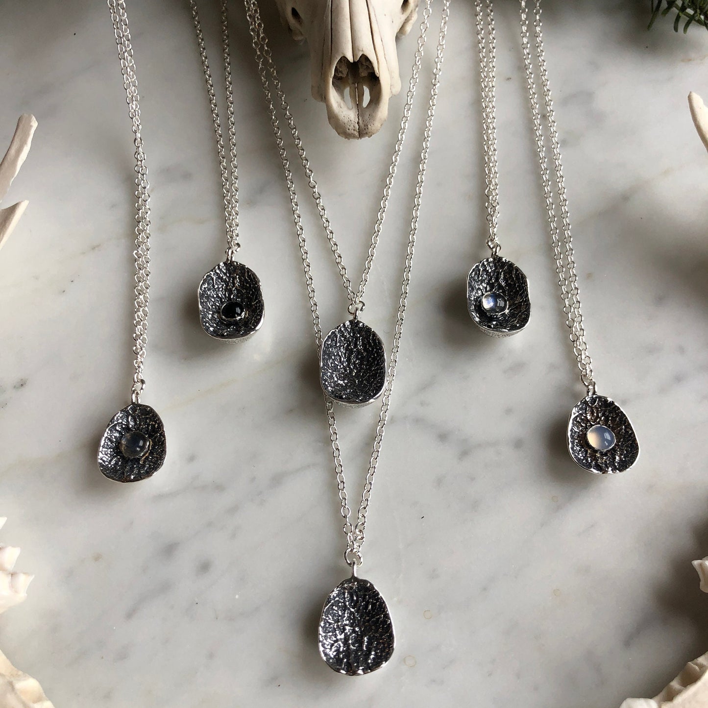 deer vertebral epiphysis necklace (7/8" cupped) with labradorite