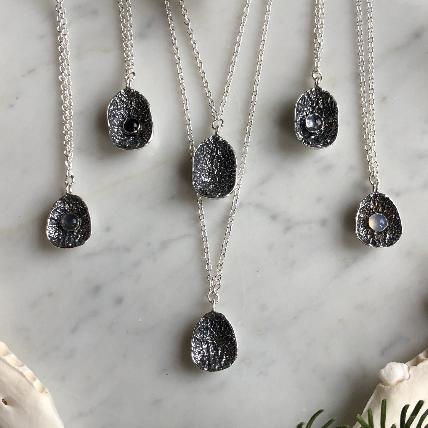 deer vertebral epiphysis necklace (7/8" cupped) with labradorite