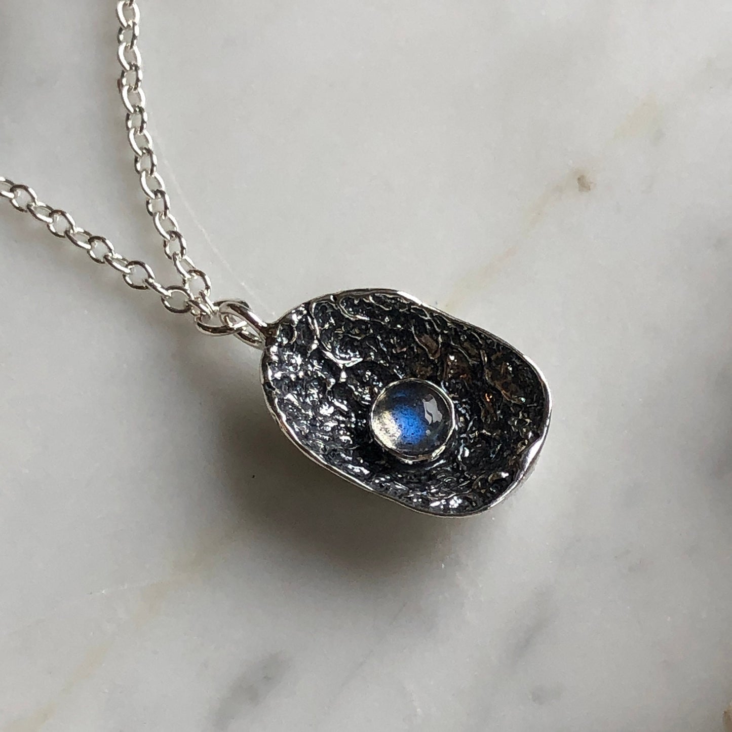deer vertebral epiphysis necklace (7/8" cupped) with labradorite