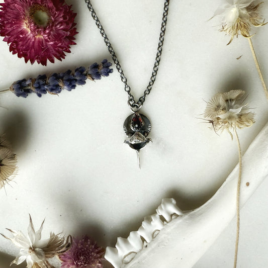 Garnet teardrop with squirrel vertebra necklace