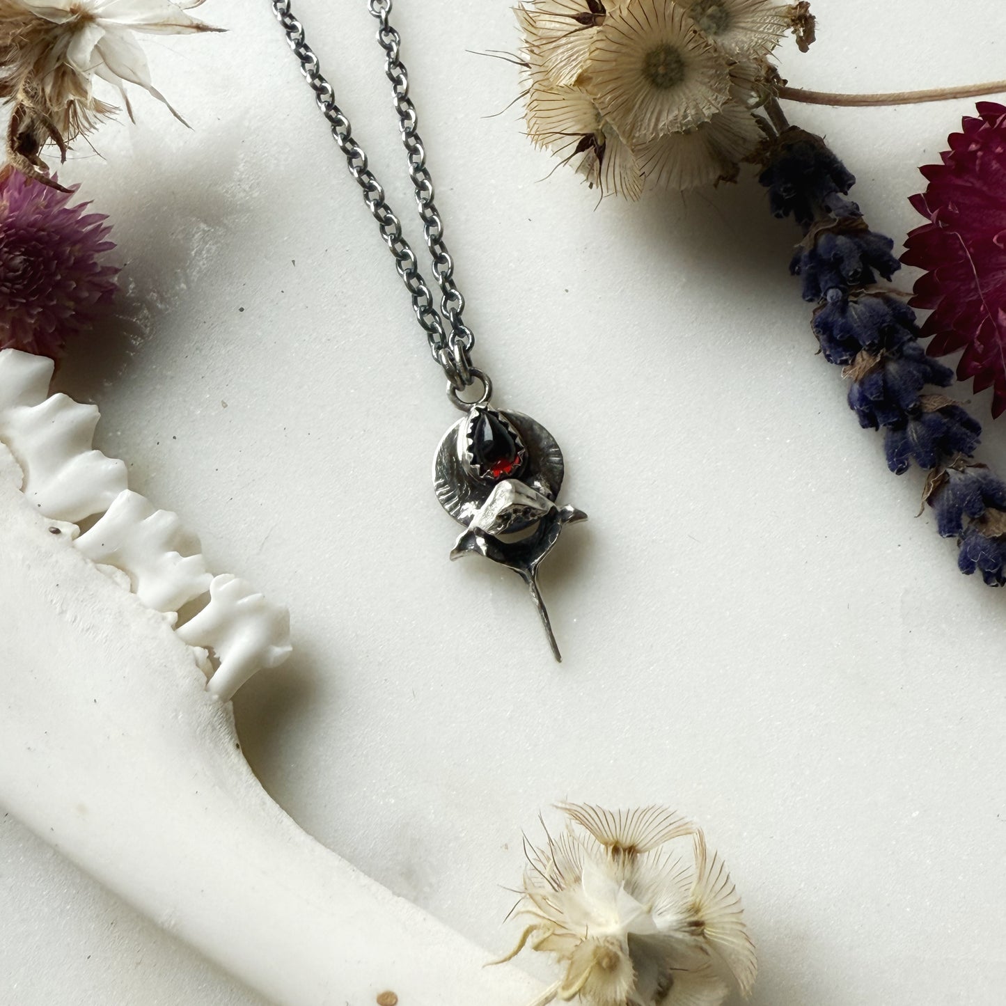 Garnet teardrop with squirrel vertebra necklace