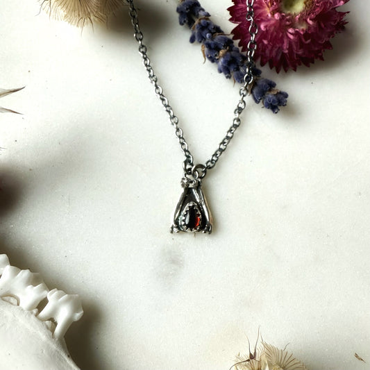 Garnet teardrop with mouse femurs necklace