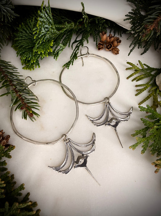 Large hoop earrings with castings of squirrel ribs and vertebrae